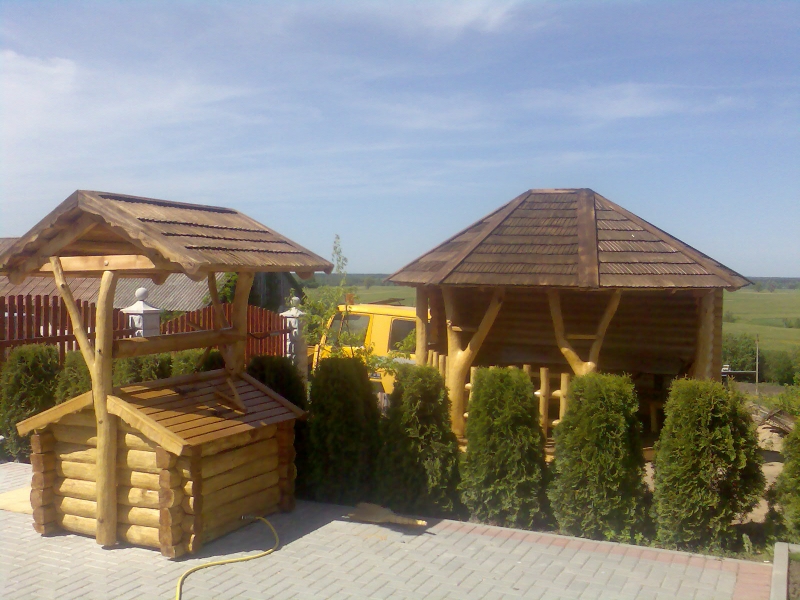 Well with a roof and a log frame by a gazebo No. 3