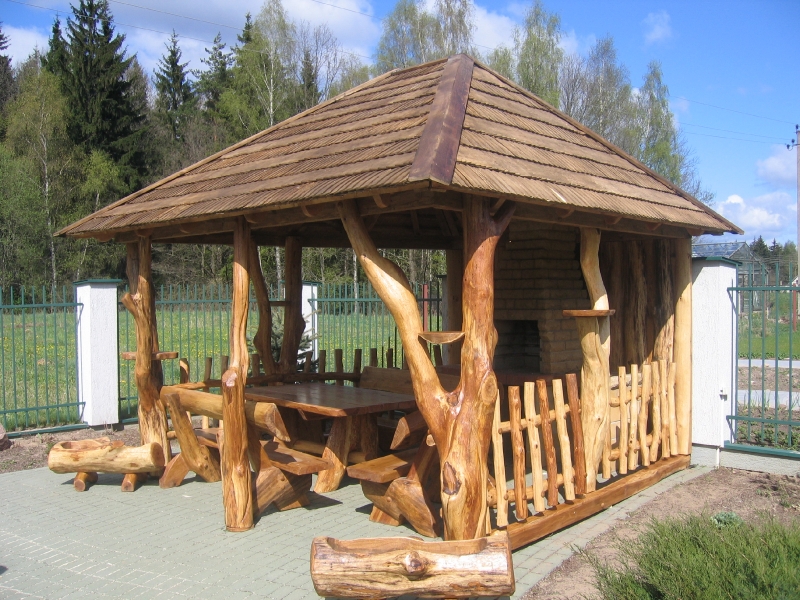 Gazebo with a fireplace, trunk columns and log benches No. 16-6