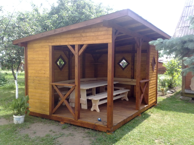 Timber-frame gazebo with diamond-shaped windows and benches No. 17